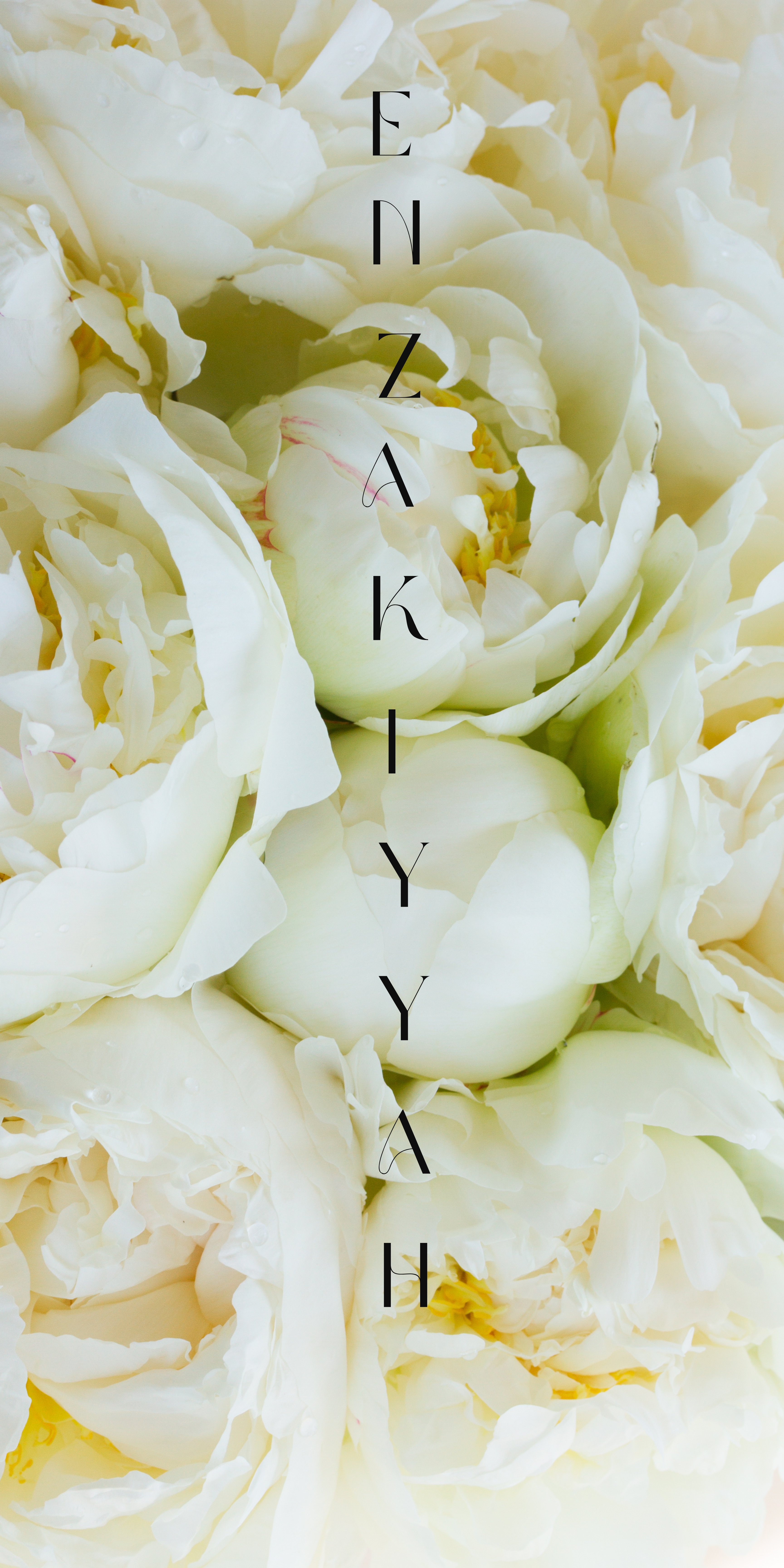 White peonies with vertical En’Zakiyyah typography